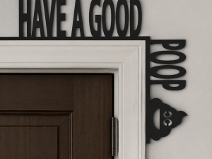 A black laser-cut silhouette sign resting on the top right corner of a white door frame. The horizontal text reads "HAVE A GOOD" and the vertical text reads "POOP," accompanied by a smiling poop emoji icon at the bottom.